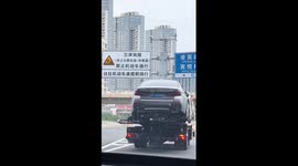 Water leaks from car exhaust on highway in China