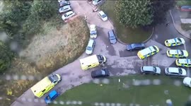 Murder probe after three people killed in a block of flats