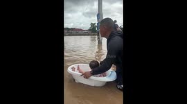 Eight-month-old baby rescued from floods in Thailand