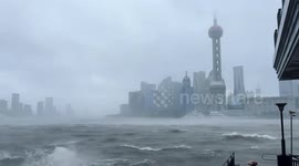 Fierce winds send waves crashing over seawall as Shanghai hit by strongest typhoon in 75 years