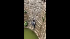 Rescuer saves drowning snake from well in Amravati, India