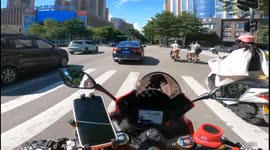 Motorcyclist knocked down by black SUV running red light in Guangdong, China
