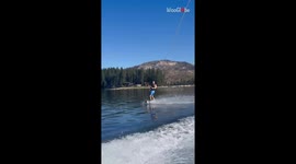 Man's daring jump over the wakeboard results in a broken binding and crash