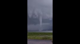 Waterspout tornado swirls across lake in Indonesia