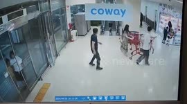 Quick-thinking shopper saves elderly woman hurtling down escalator