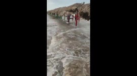 Ocean flooding with high waves at Delfines Playa Miramar in Mexico