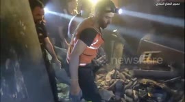 Palestine: Civil Defense crews retrieve the bodies of two following Israeli air strike in the Al-Sabra area, south of Gaza City
