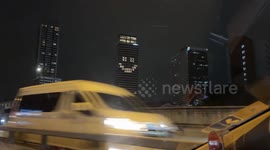Office staff make smiley face with room lights