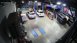 Repair shop uses hydraulic lifts to keep cars safe from flood water