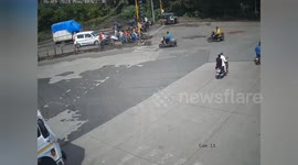 India: Man narrowly escapes from under truck as it hits his two-wheeler in Thane, Maharashtra