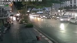 Tree topples onto passing pickup truck during storm in Bangkok