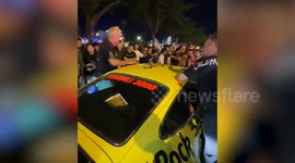 Porsche 911 needs pushing at the start of Gumball 3000 Rally in Cambodia
