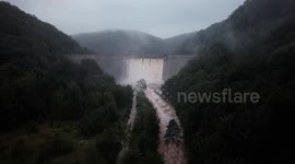 Water overflowing over dam during flood in Poland