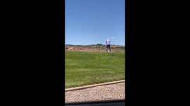 Golfer put off by car's horn throws club at vehicle