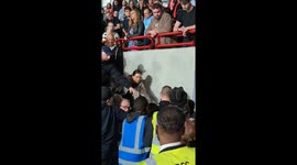 Stwards at Brentford FC clash with Leyton Orient supporters during the Carabao Cup game