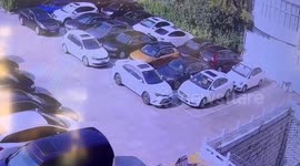 Shocking moment bad driver shunts another vehicle from car park roof