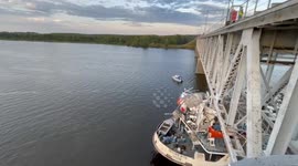 Russian ship gets stuck under bridge after miscalculating height