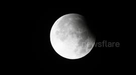 Partial lunar eclipse of harvest moon delights stargazers in UK