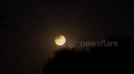 Partial Lunar Eclipse Coinciding With Harvest Supermoon Lights Up Night Skies