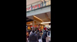 Activists march through Canberra Centre while advocating for peace in Palestine