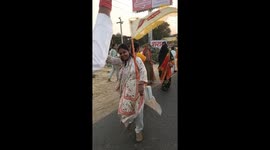 Hindu devotees dance in a religious procession of Lord Khatu Shyam in India
