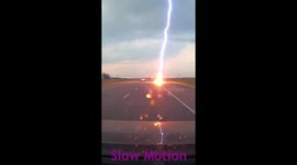 Lightning strikes road just metres in front of car, moment caught on dashcam