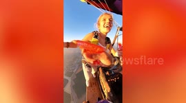 Adventurous couple have mid-air water gun fight at 5,000ft