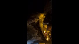 Crashing Waves Threatens to Wash Away SUV