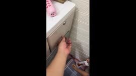 Toddler uses hairpin to pick drawer lock