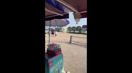 Dust devil tornado zips through coach park