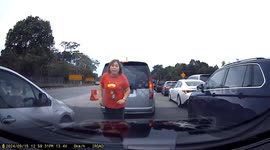 Woman jumps in front of car to allow her husband to cut into lane