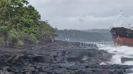 Oil tanker runs aground on rocky outcrop amid storm in Thailand