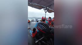 Thai navy rescue 143 tourists stranded on Thai island being battered by Tropical Storm Pulasan