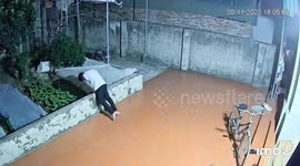Person falls after balancing on wall in Hanoi CCTV footage