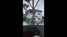 Father teaches toddler how to pick herself back up from a fall