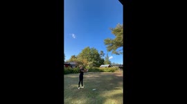 Curious woman conducts Bottle Rocket experiment using water, blue liquid & compressed air