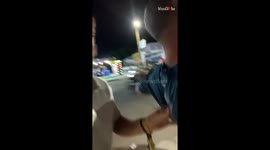 Tipsy lad embarrassingly loses balance during confrontation and gets help from friend