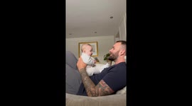 Dad's funny reenactment of monkey sounds gives baby daughter her 1st big belly laugh!