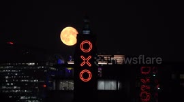The September Full Moon known as the Harvest Moon is seen rising behind the OXO Tower in London
