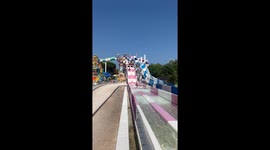 Waterslide race between brothers ends in a sudden collision with a little girl