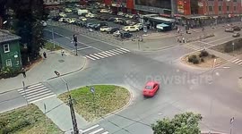 Lucky woman narrowly avoids being hit by crashing car just centimeters away from her