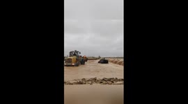 Police, forklift driver rescue 4 people trapped in vehicle amid flood