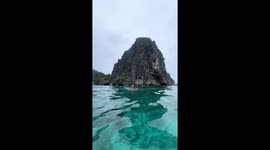 Freediver bumps into another swimmer in El Nido, Philippines