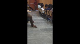 Student's stealthy entrance to lecture hall sparks laughter