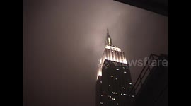 Camcorder Footage of Empire State Building covered in fog during wet snowfall - Part 1