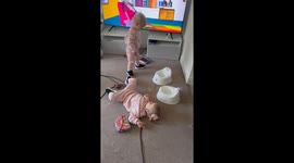 Toddler shows attitude while twin remains oblivious