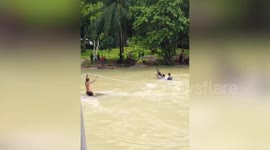 Villagers rescue schoolgirls trapped in flash flood in Thailand