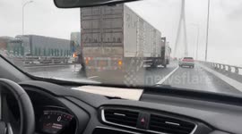 China: A Small Truck Prevents A Large One From Rollover