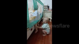 China: A Baby Calls Help for His Stuck Brother