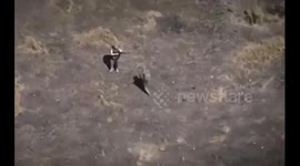 Russian soldier shoots down Ukrainian drone by throwing machine gun at it